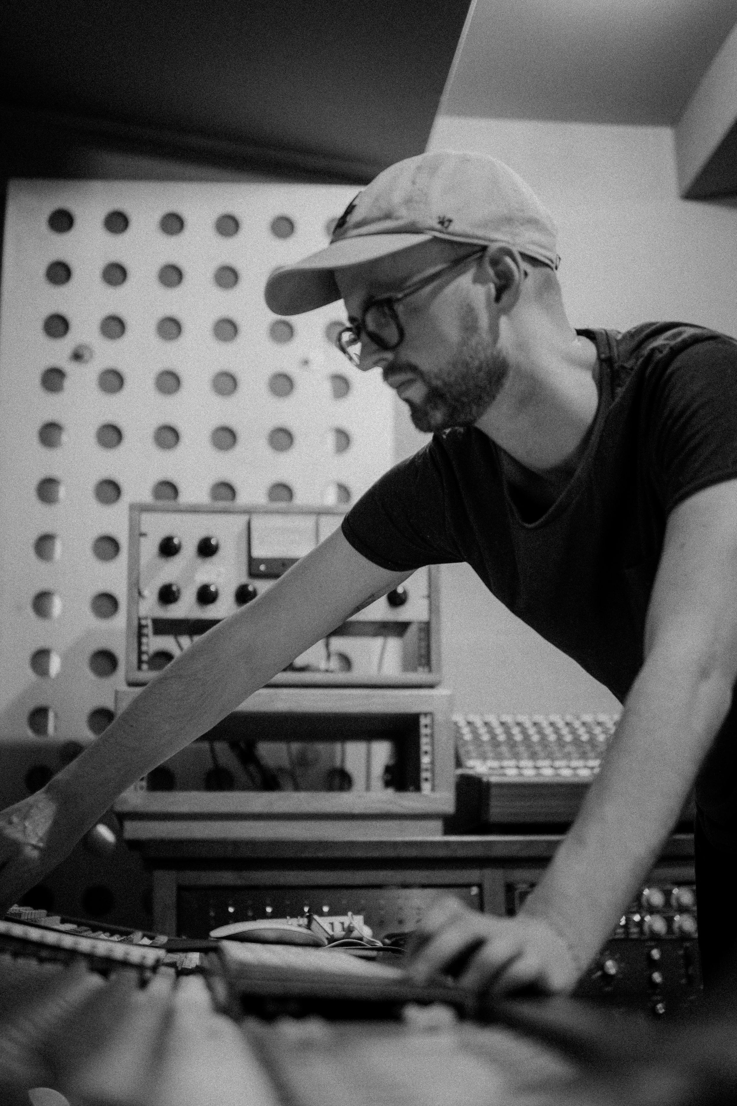 Recording engineer working with a Studer A80 2-inch multitrack analogue tape machine