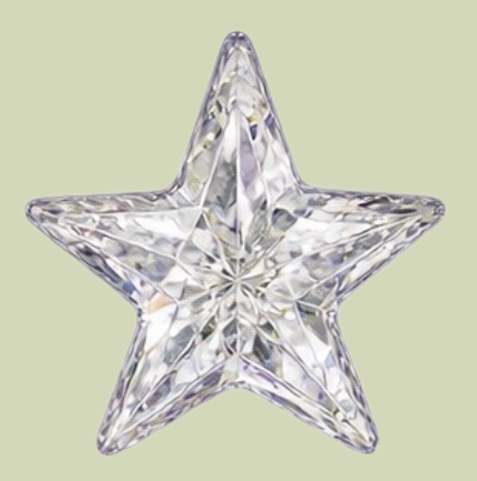 A clear, faceted star-shaped crystal ornament.