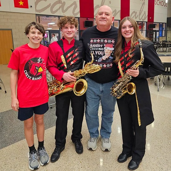 Photo of Eric with band kids