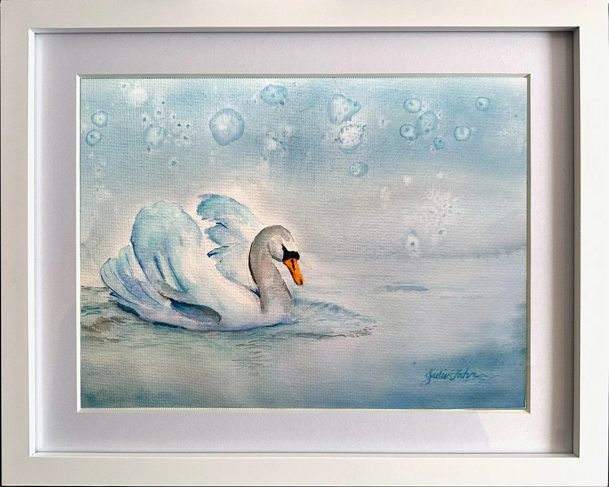 Swan in Snowy Silence: A quiet watercolor study in soft winter blues, capturing a solitary swan gliding through still water as snow drifts gently around it. Donated to a Blue River Arts Council fundraiser.