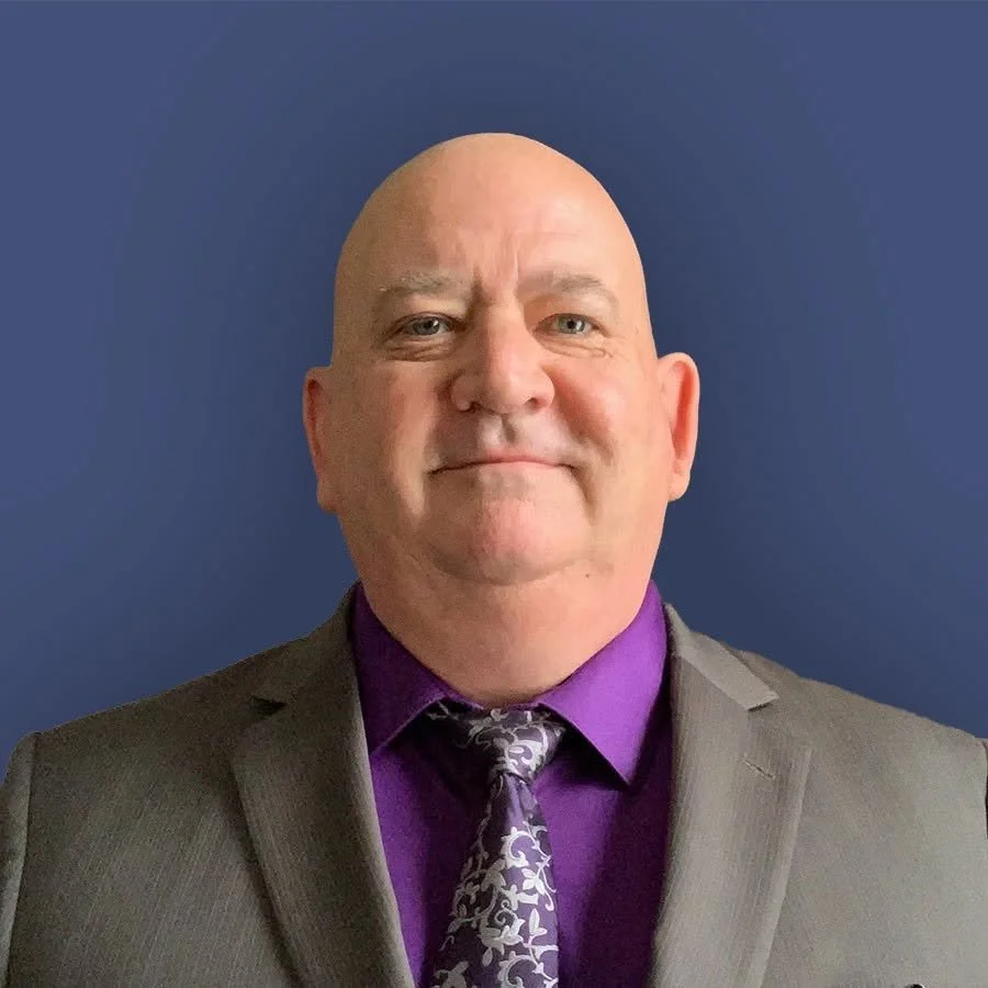 Photo of Eric Fahrlander in a suit