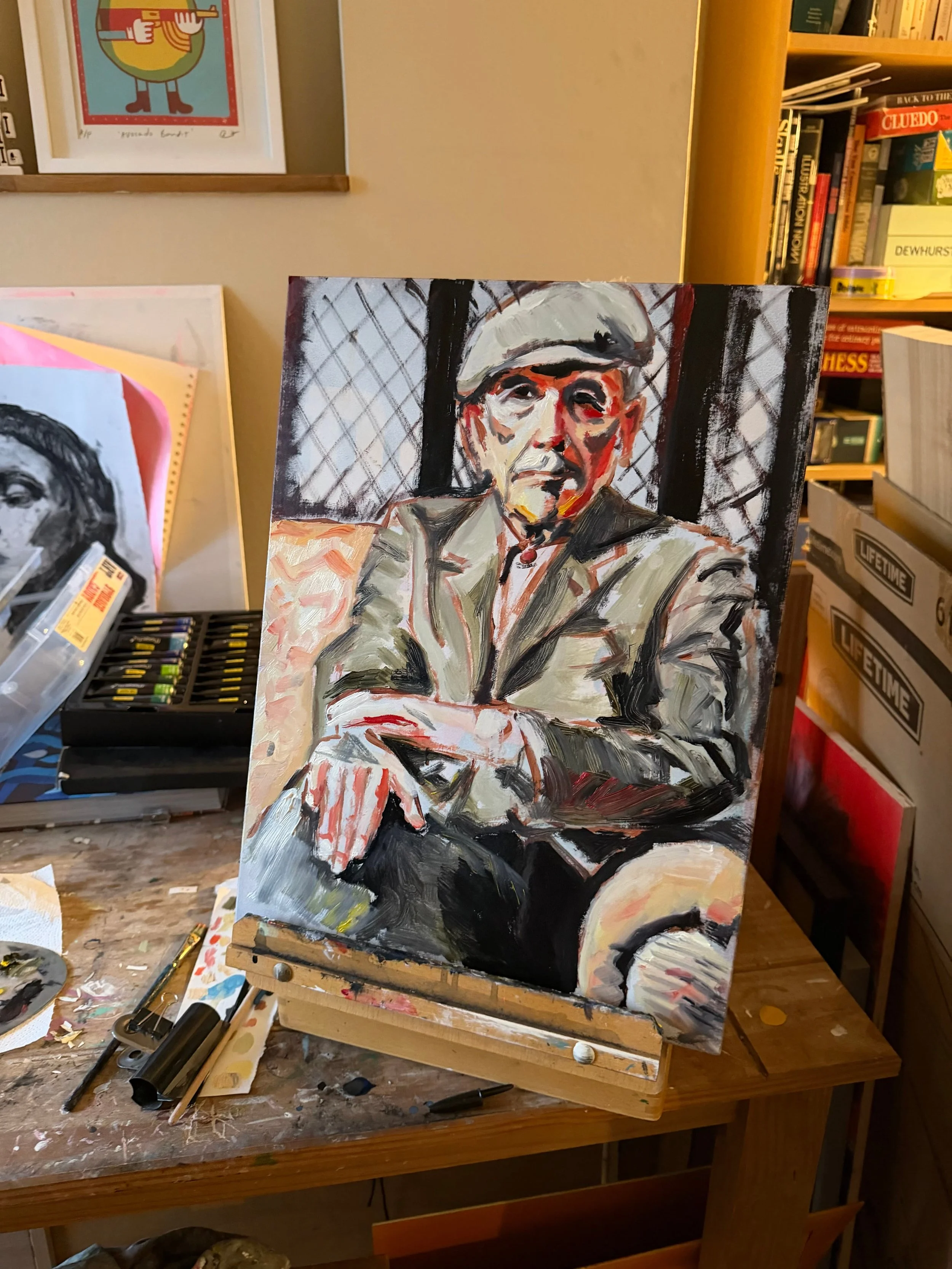 In the Studio - A finished oil painting of Leonard Cohen on an artists easel