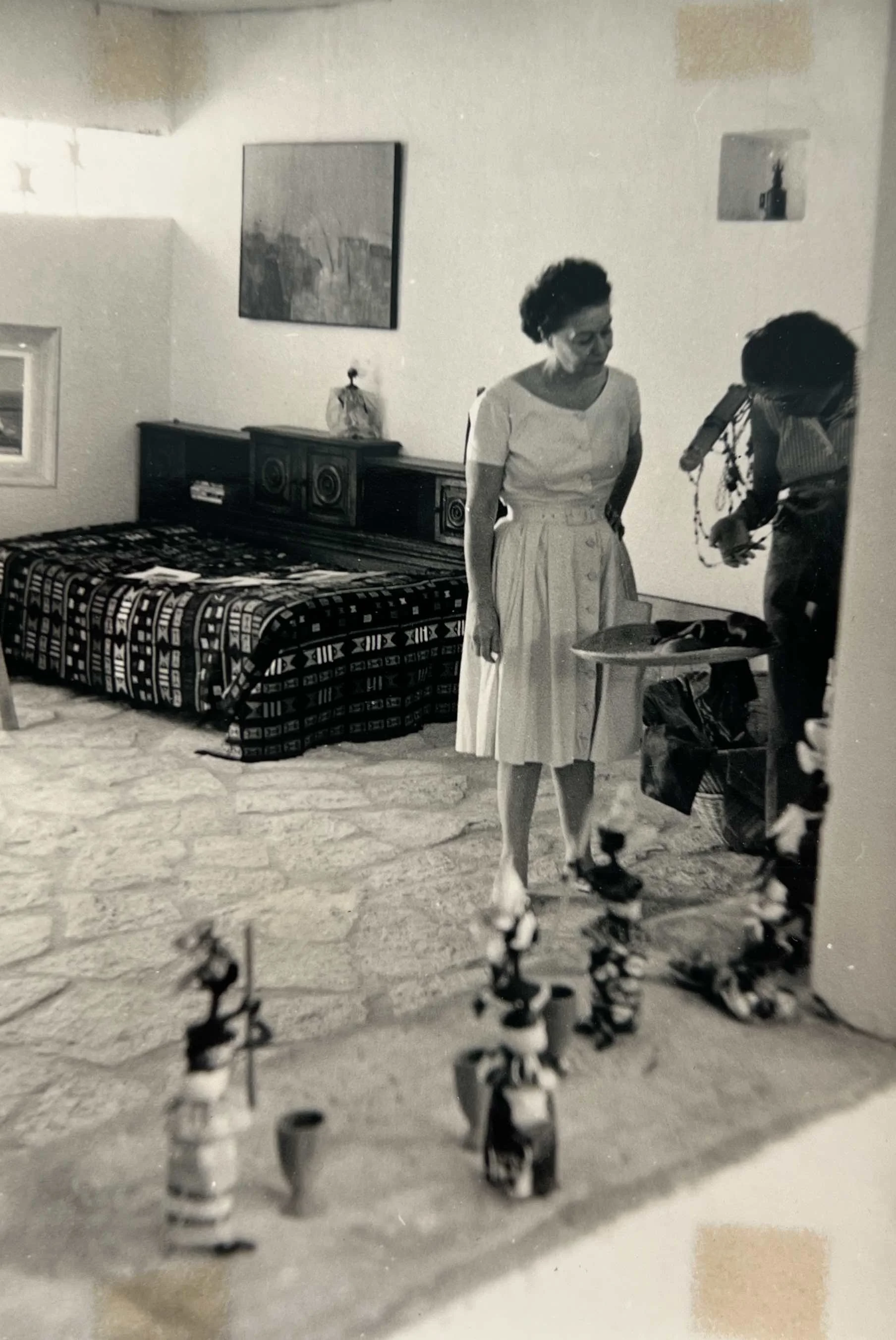 Mireille Jacques in Gorée, Senegal, with a painting by Hans Zandvoort visible on the wall, c. 1965–1966.