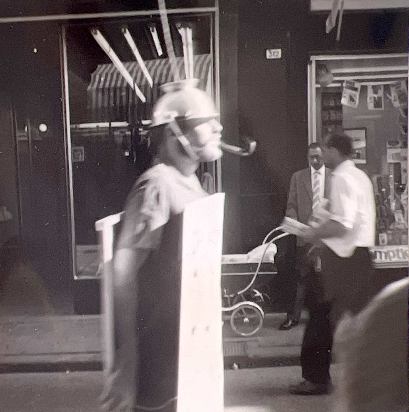 Hans Zandvoort wearing a Spoutnik headdress and carrying a “De Poëzie van de Ruimte” sign in Dordrecht, 1961.