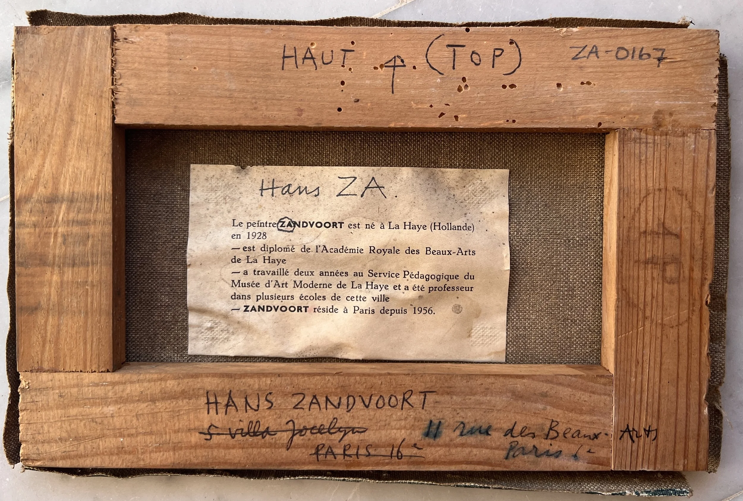 Reverse of a painting by Hans Zandvoort, showing an artist label, handwritten inscriptions and markings on the stretcher.