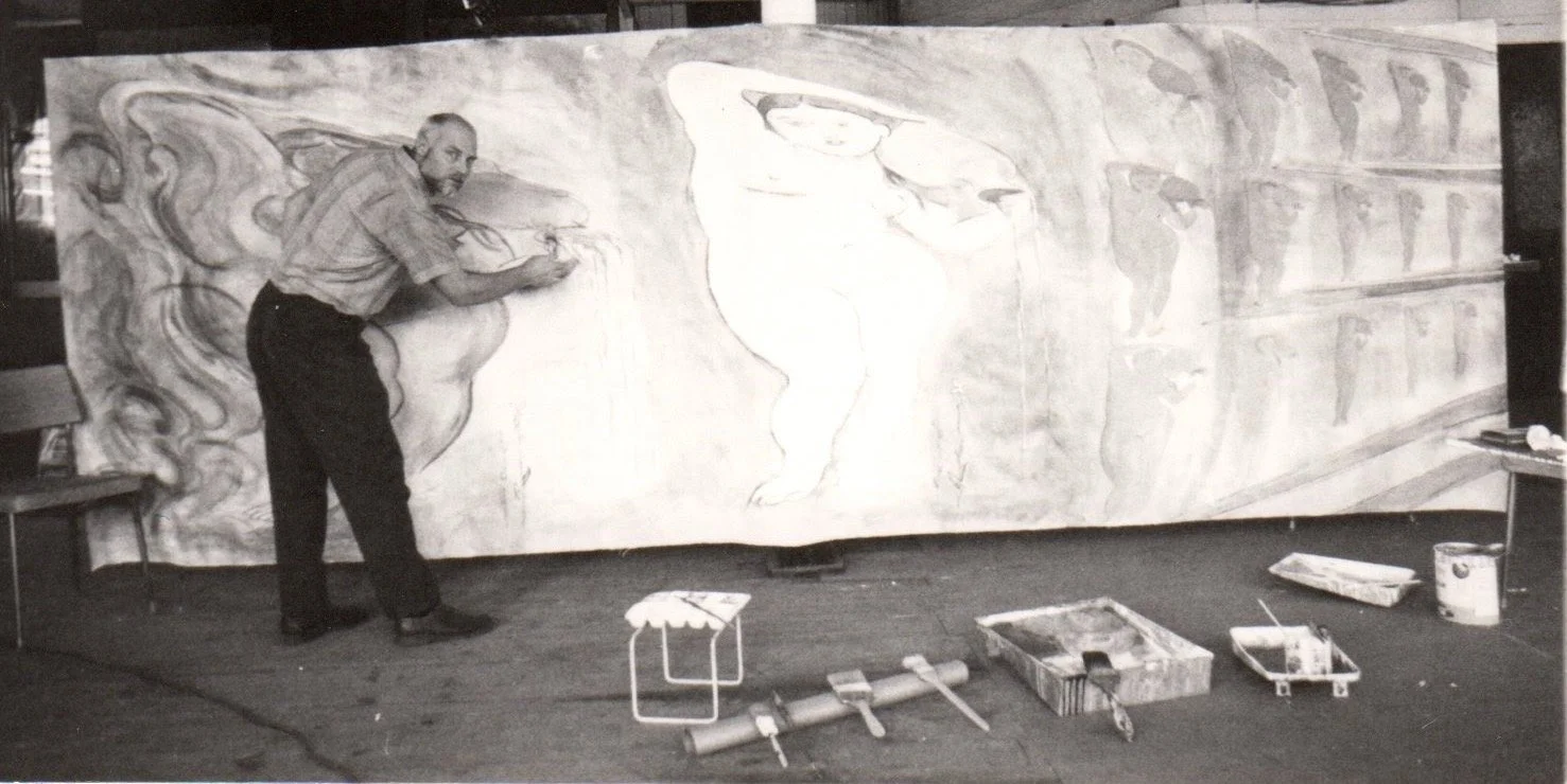 Hans Zandvoort working on a large-scale artwork in his studio in Rochester, New York, surrounded by painting materials.