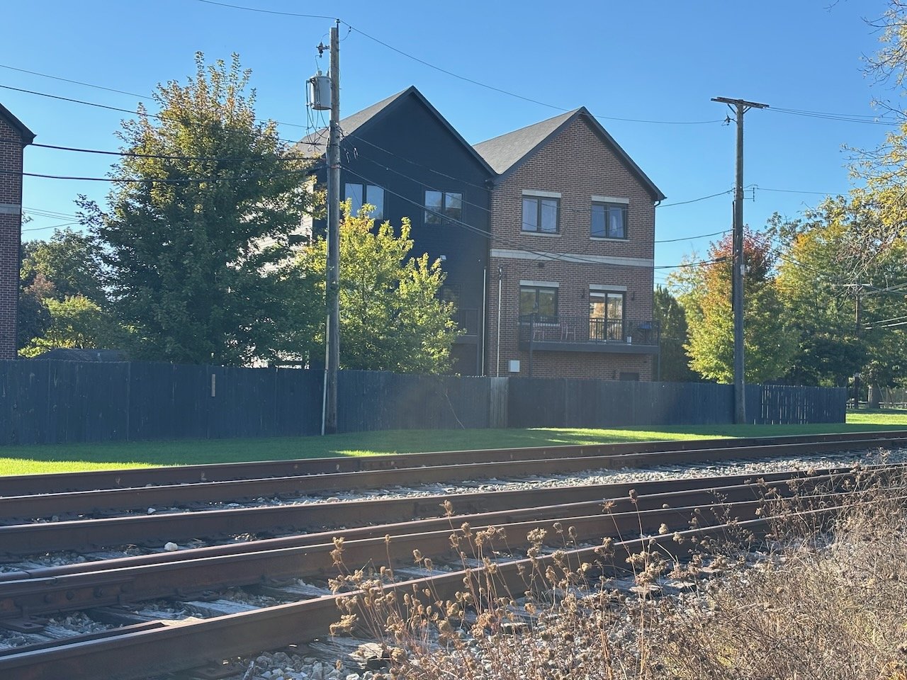 View of Van Buren townhouses from end of Adams Street, across the tracks 3.jpeg