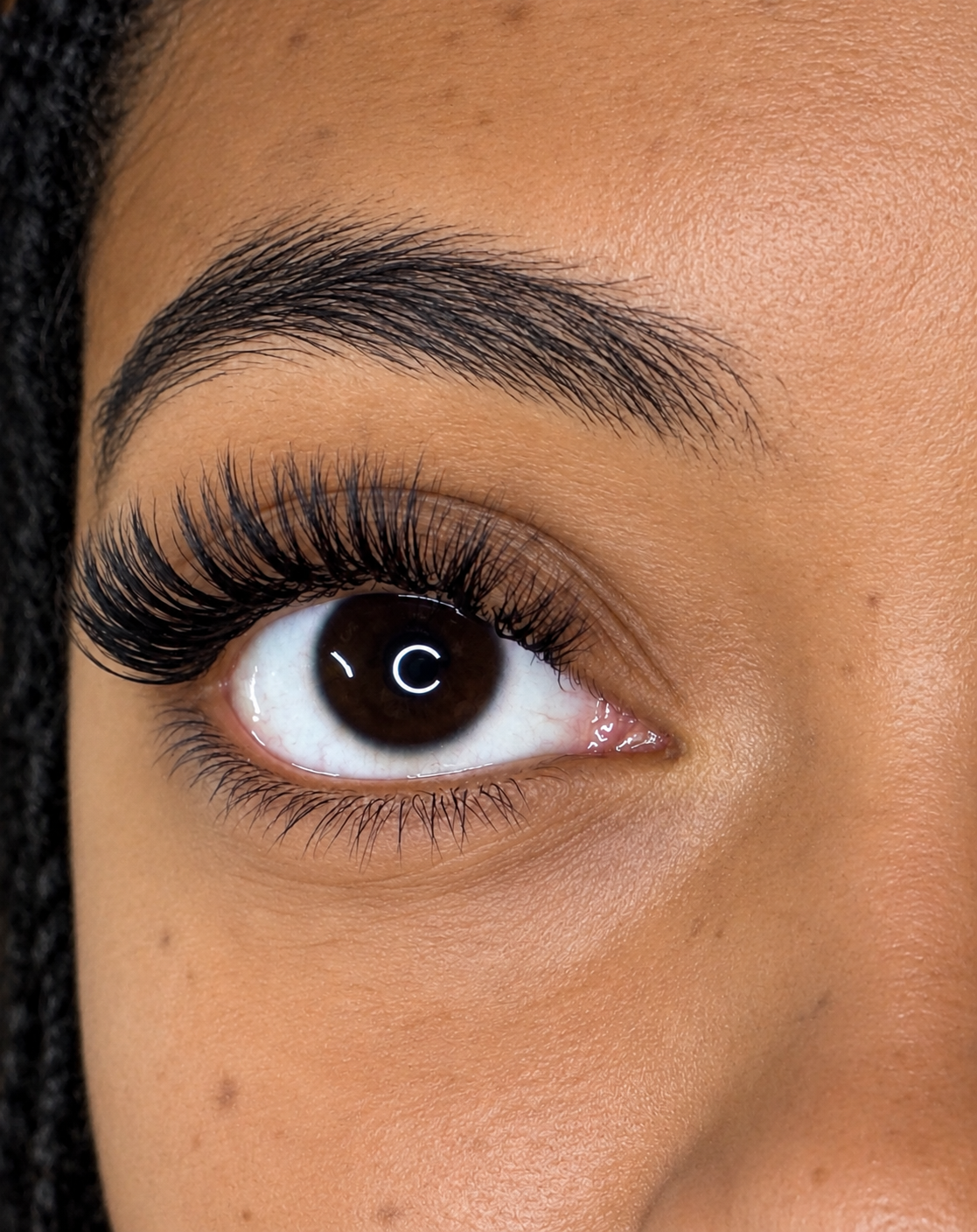     Client wearing customized lash extensions after her appointment at Flaunt & Flutter Lashery in York, PA.