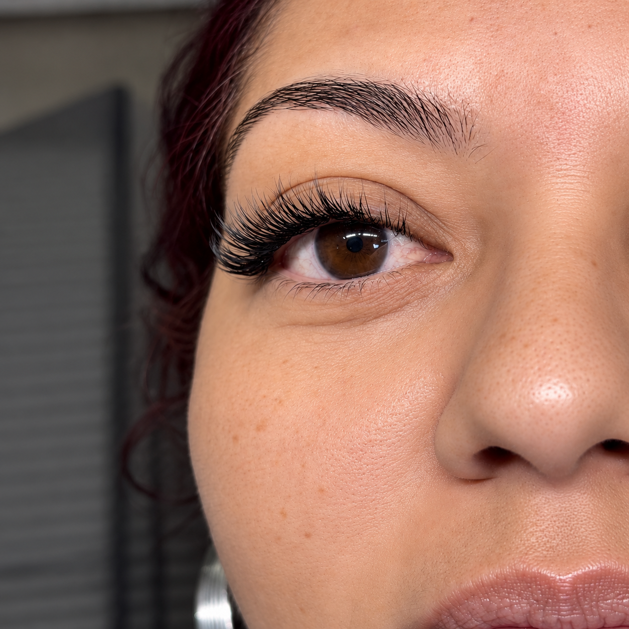     Close-up of soft natural lash extensions customized for a client at Flaunt & Flutter Lashery in York, PA.