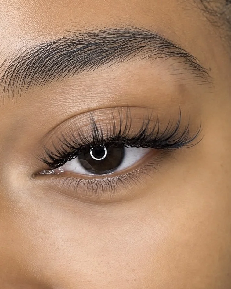     Close-up of soft natural lash extensions customized for a client at Flaunt & Flutter Lashery in York, PA.