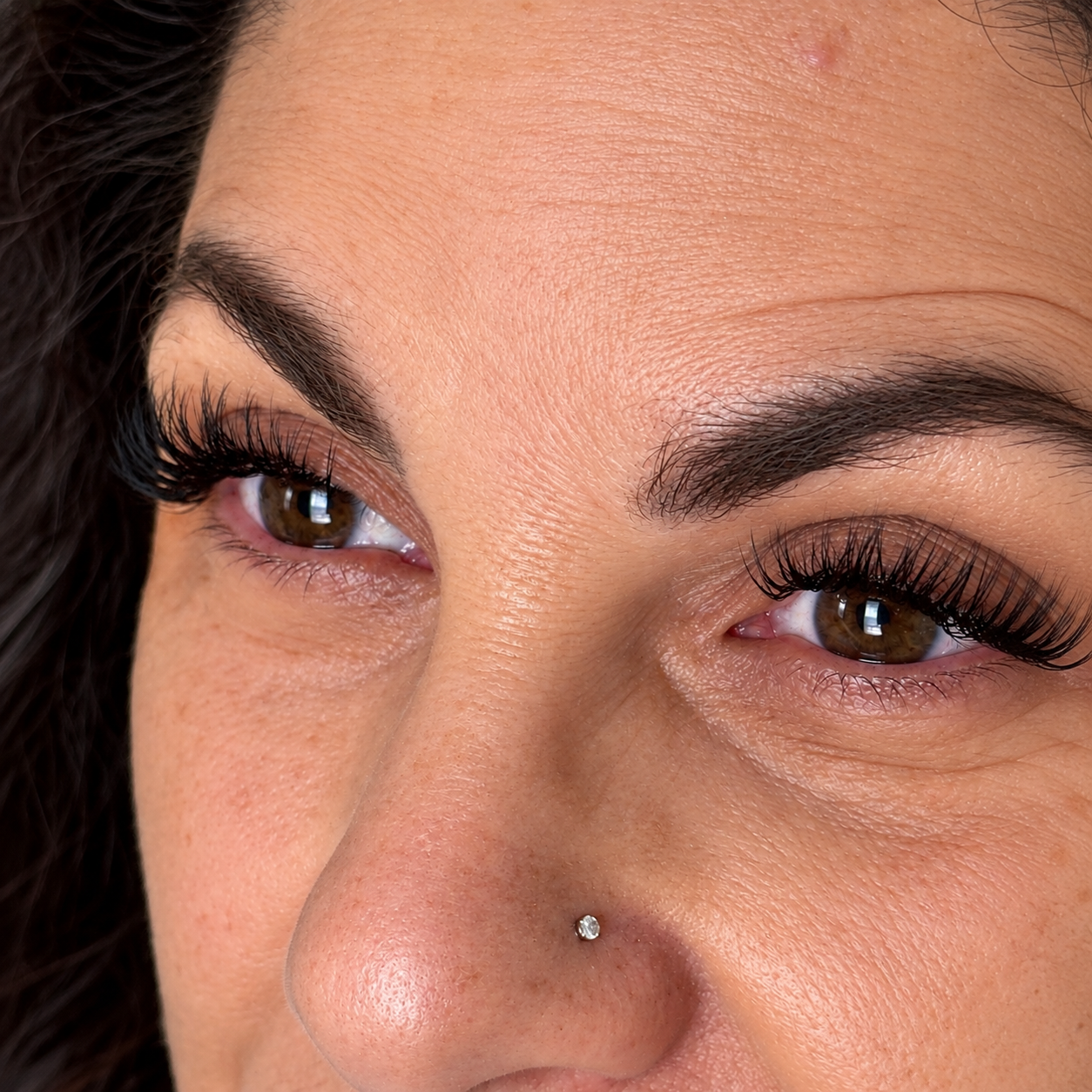     Close-up of custom volume lash extensions with a soft, full finish at Flaunt & Flutter Lashery.