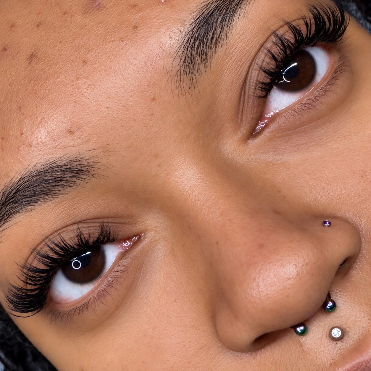     Close-up of custom volume lash extensions with a soft, full finish at Flaunt & Flutter Lashery.