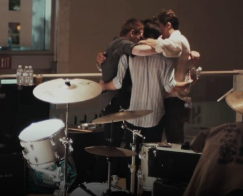 Breaking: Los Angeles documentary still of Chasing Kings band members backstage before a performance.