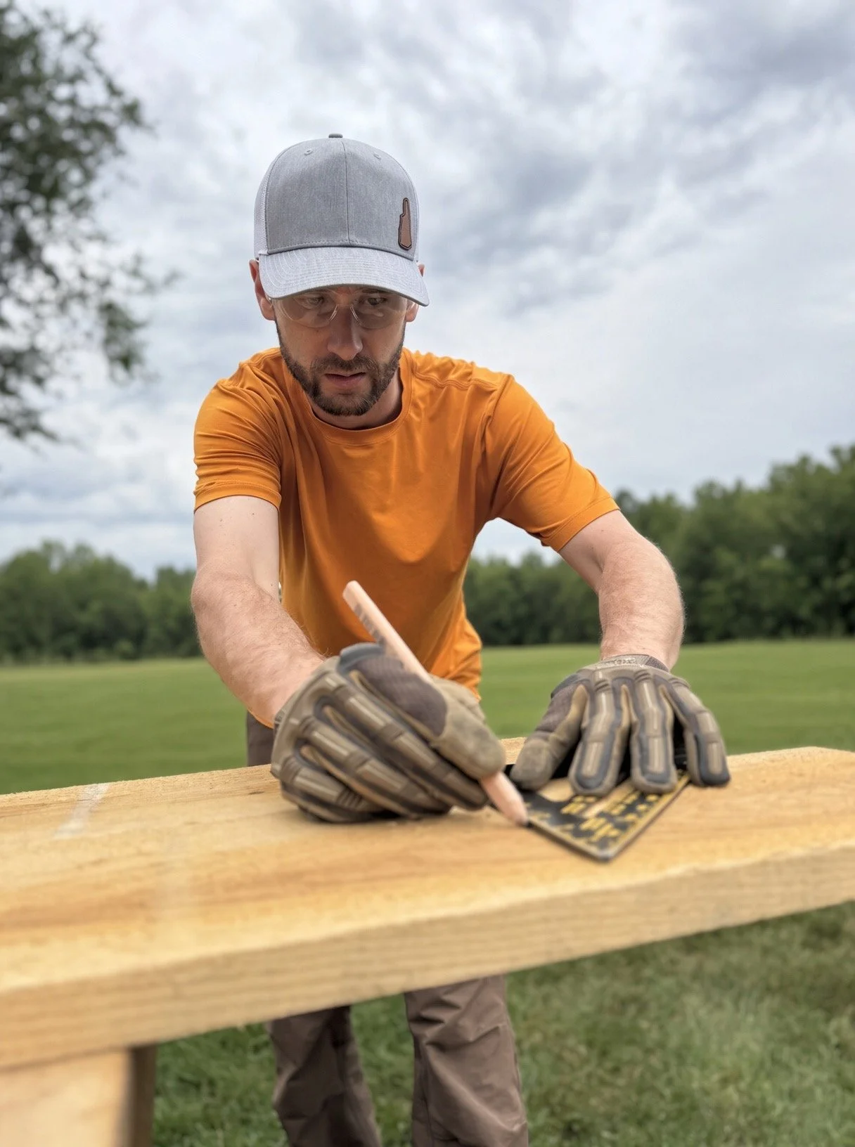 Property claims professional with construction and restoration background measuring building materials during project planning and scope development.