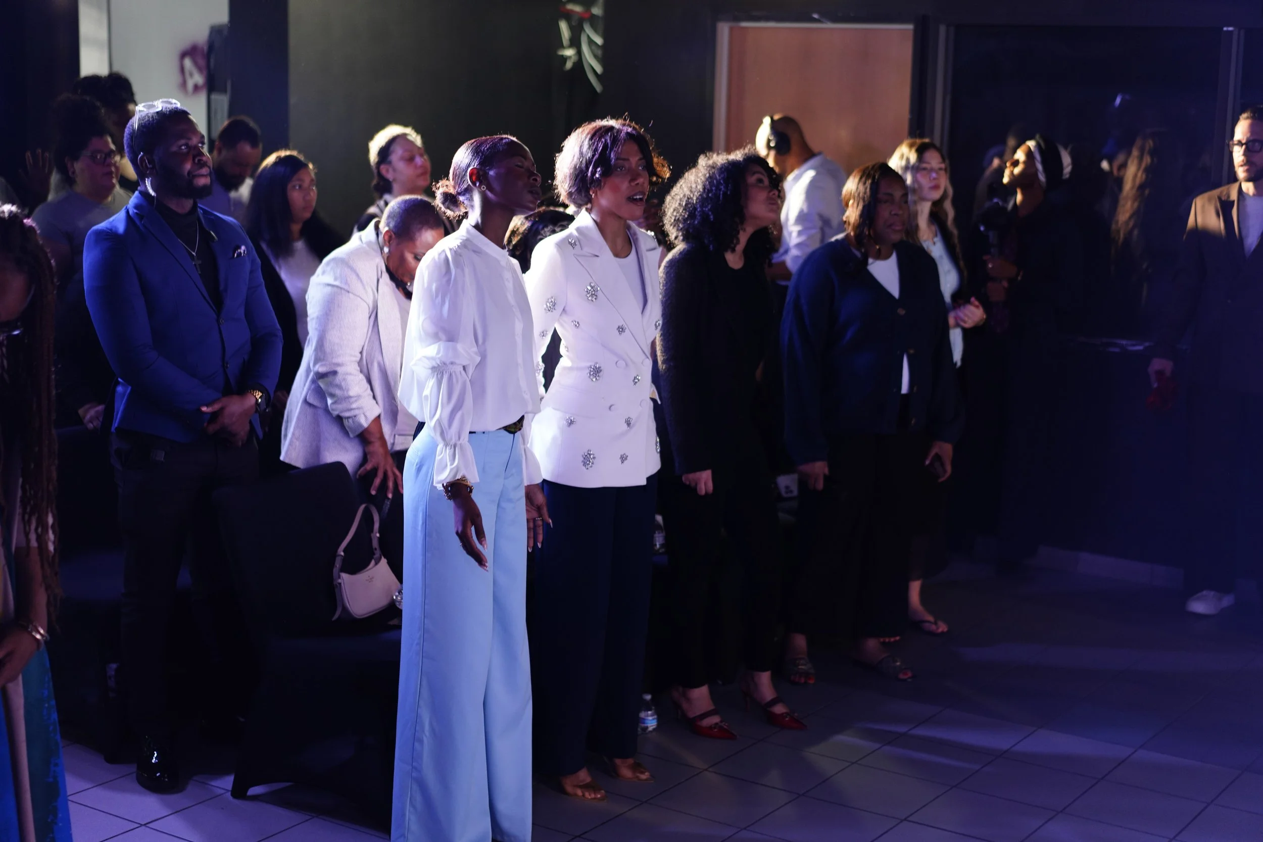 Attendees praying together during a Prophet Jahhel Chosen Ministries prophetic prayer gathering.