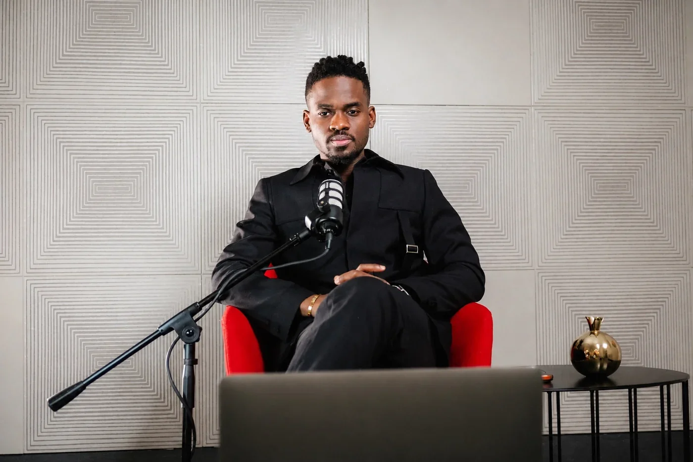 Prophet Jahhel Chosen seated at a microphone for a ministry teaching