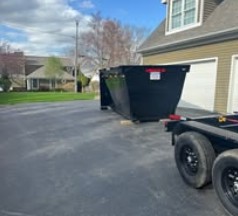 Dumpster in front of house garage.png