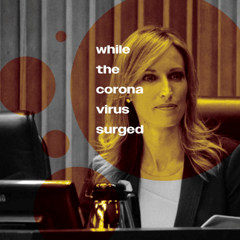 A woman sitting at a desk with a computer, with a graphic overlay of orange circles and the text "while the coronavirus surged".
