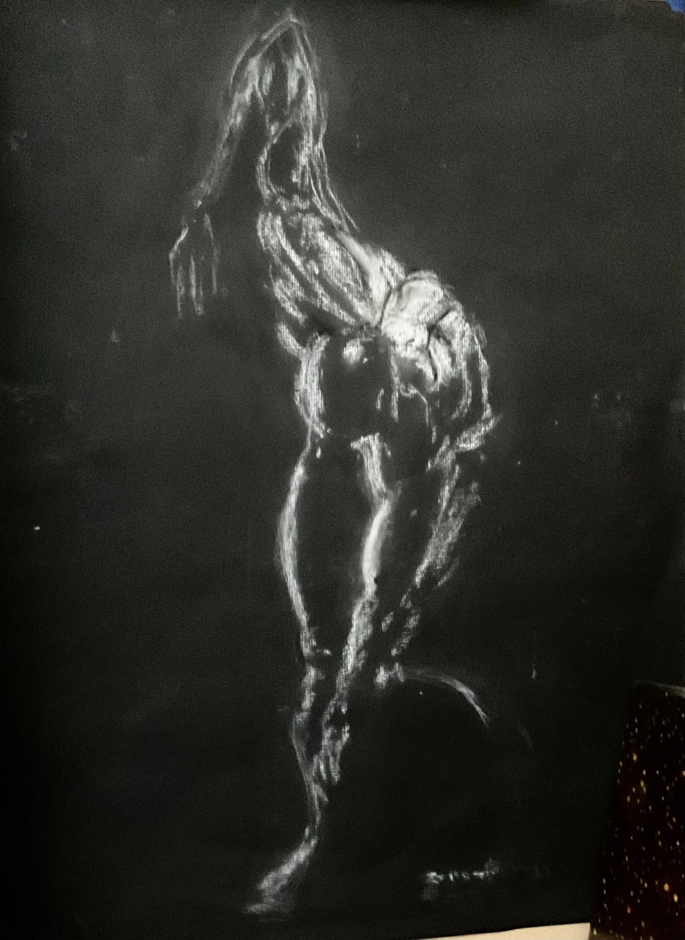 A black and white light painting of a dancer, standing with there hands on her chest, with long hair, against a dark background.