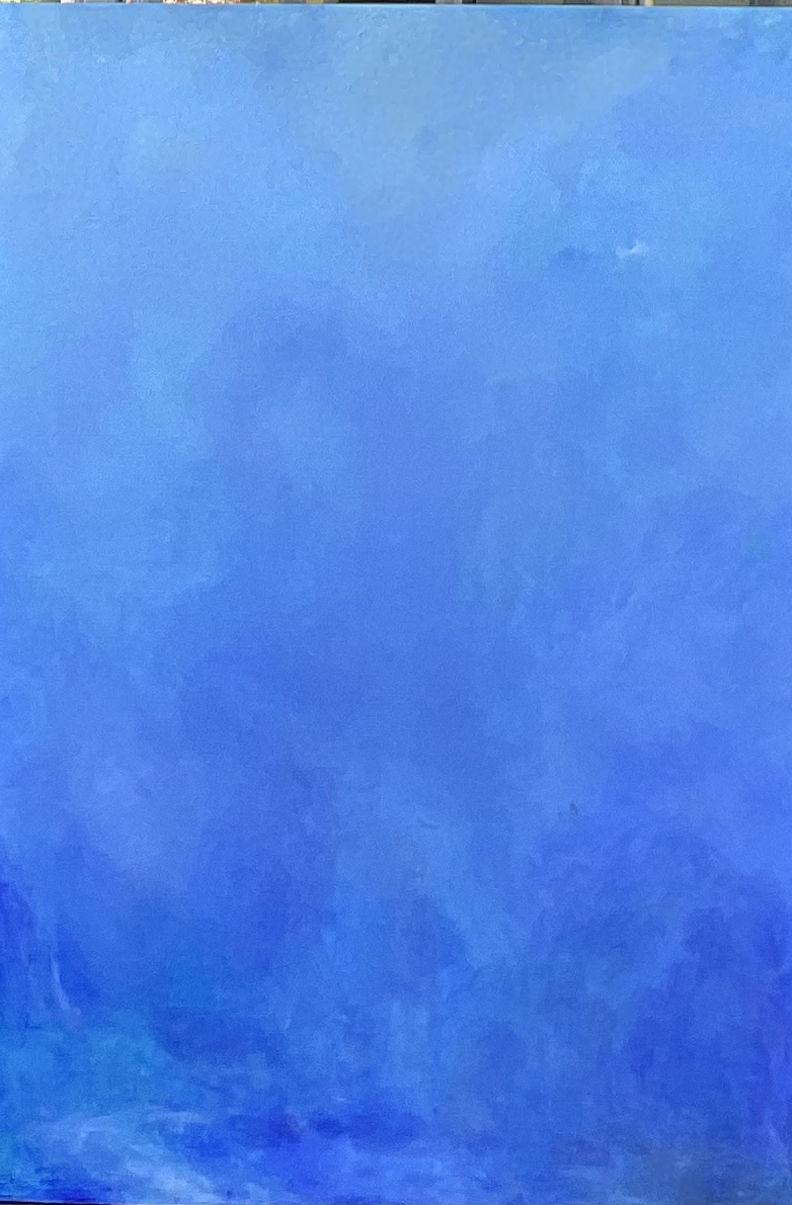 A vibrant blue abstract painting with textured brushstrokes.