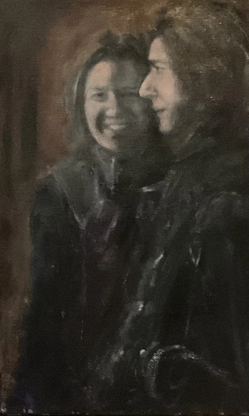 A  Jerry Garcia and MountainGirl standing close together, smiling and looking at each other, with the MountainGirl smiling at the camera.