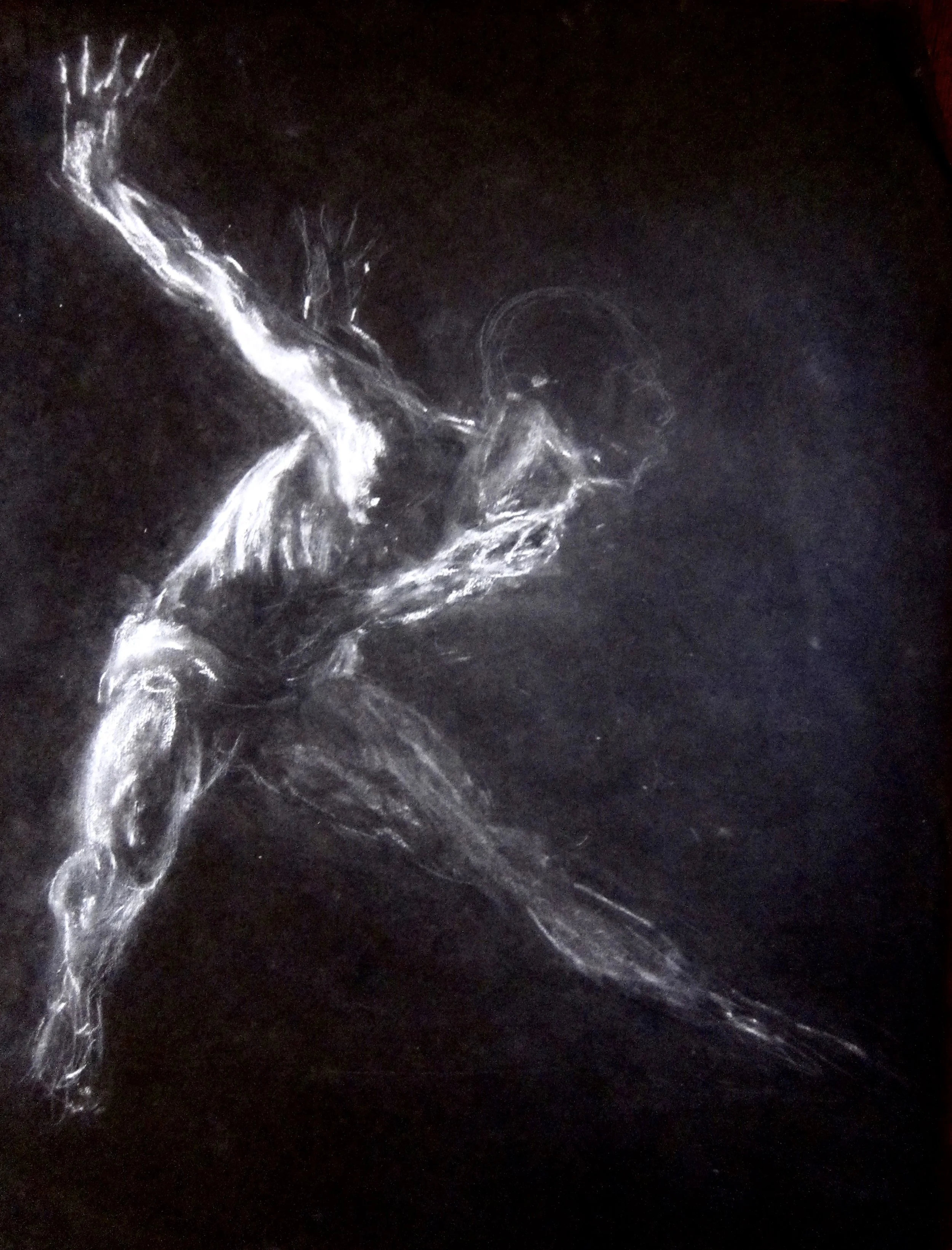 Ice skater performing a spin on ice in a dark setting, capturing motion with a trail of ice shavings.