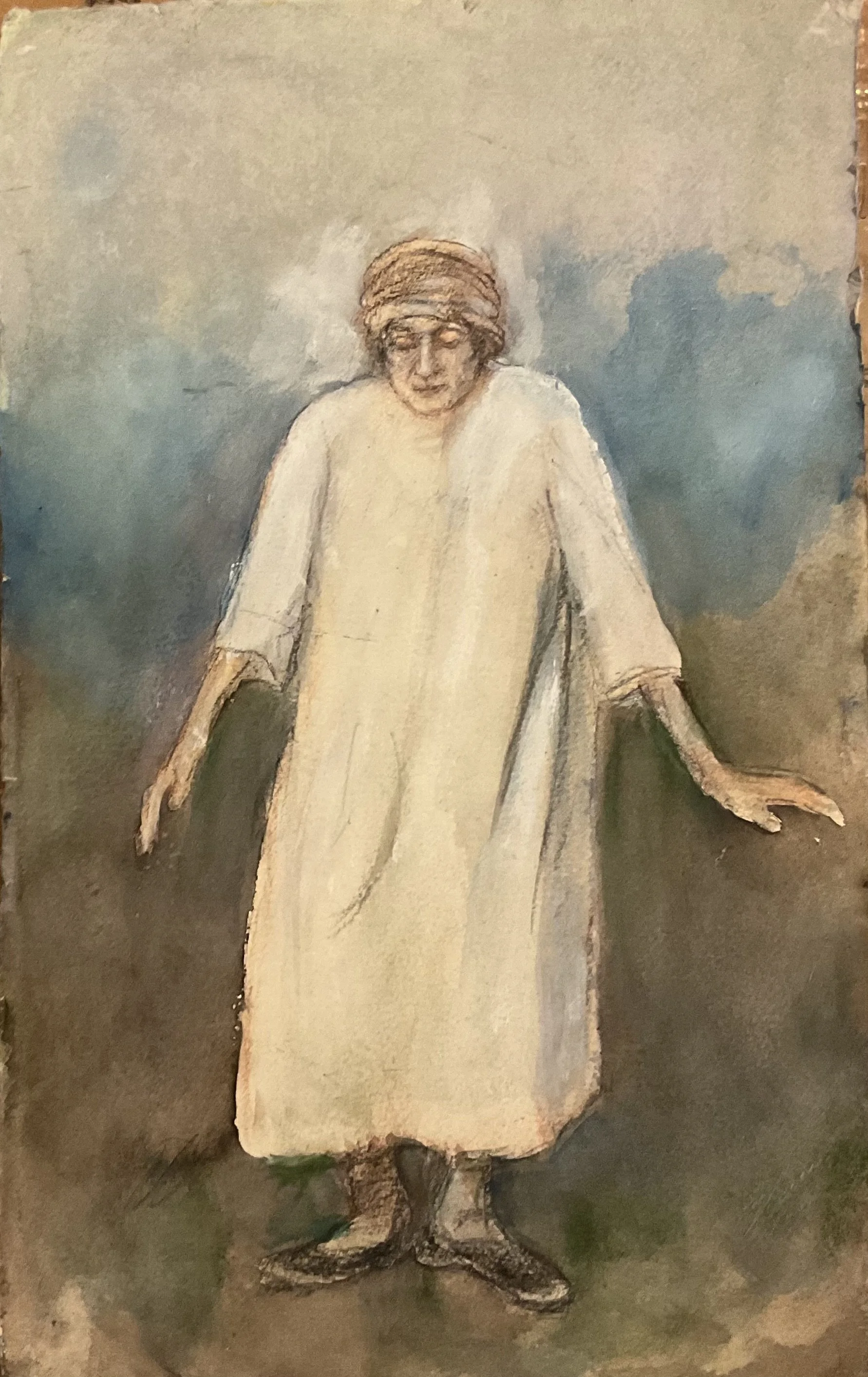 An elderly person wearing a beige coat, a turban, and black boots, standing outdoors with arms outstretched on a cloudy day.