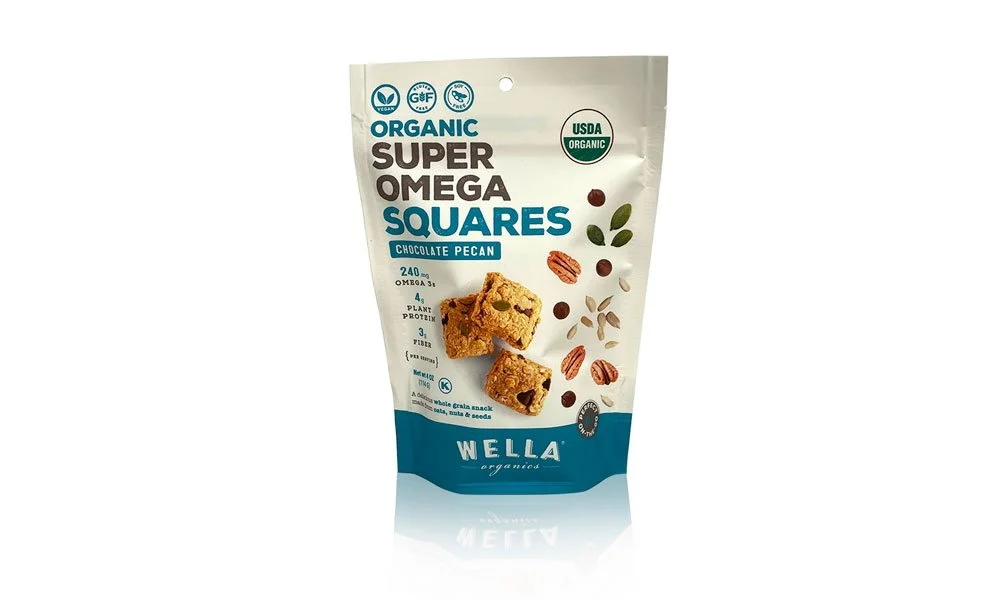 Organic super omega squares in a white and blue stand-up pouch with images of chocolate pecan flavor, featuring some squares and ingredients like nuts and seeds.