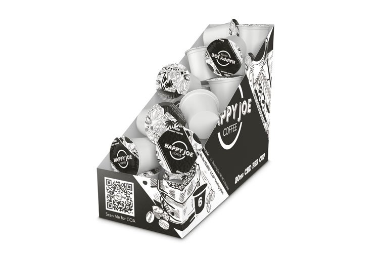 Display of Happy Joe coffee pods in a black and white box with a QR code on the side.