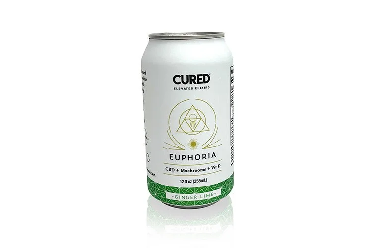 A white can of CURED Euphoria beverage with green accents, labeled as ginger lime flavor, containing CBD, mushrooms, and vitamin D, with a botanical design on the front.