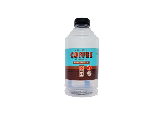 A clear plastic bottle of cold brew coffee concentrate with a black cap and a light blue and brown label reading 'Cold Brew Coffee Concentrate Touched Coconut'.