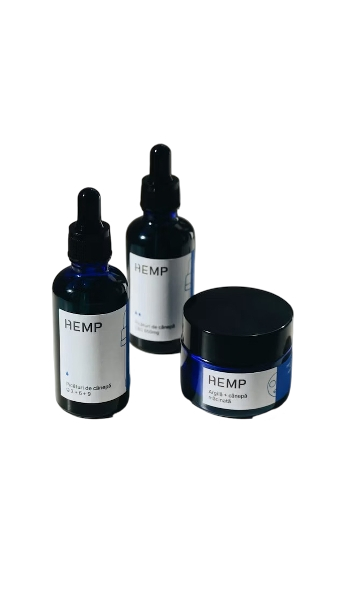 Three containers of hemp skincare products, including two dropper bottles and a jar, with labels indicating hemp extract ingredients.