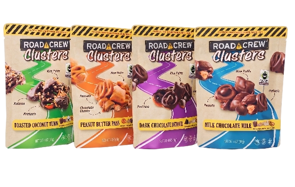 Four packages of Road Crew Clusters candy in different flavors: toasted coconut, peanut butter, dark chocolate, and milk chocolate, arranged in a row.