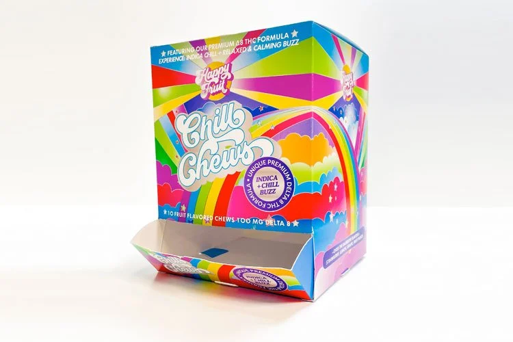 Colorful box of Chill Chews with rainbow graphics and clouds, featuring fruit flavors, 10 chews, and 100mg Delta 8 THC.