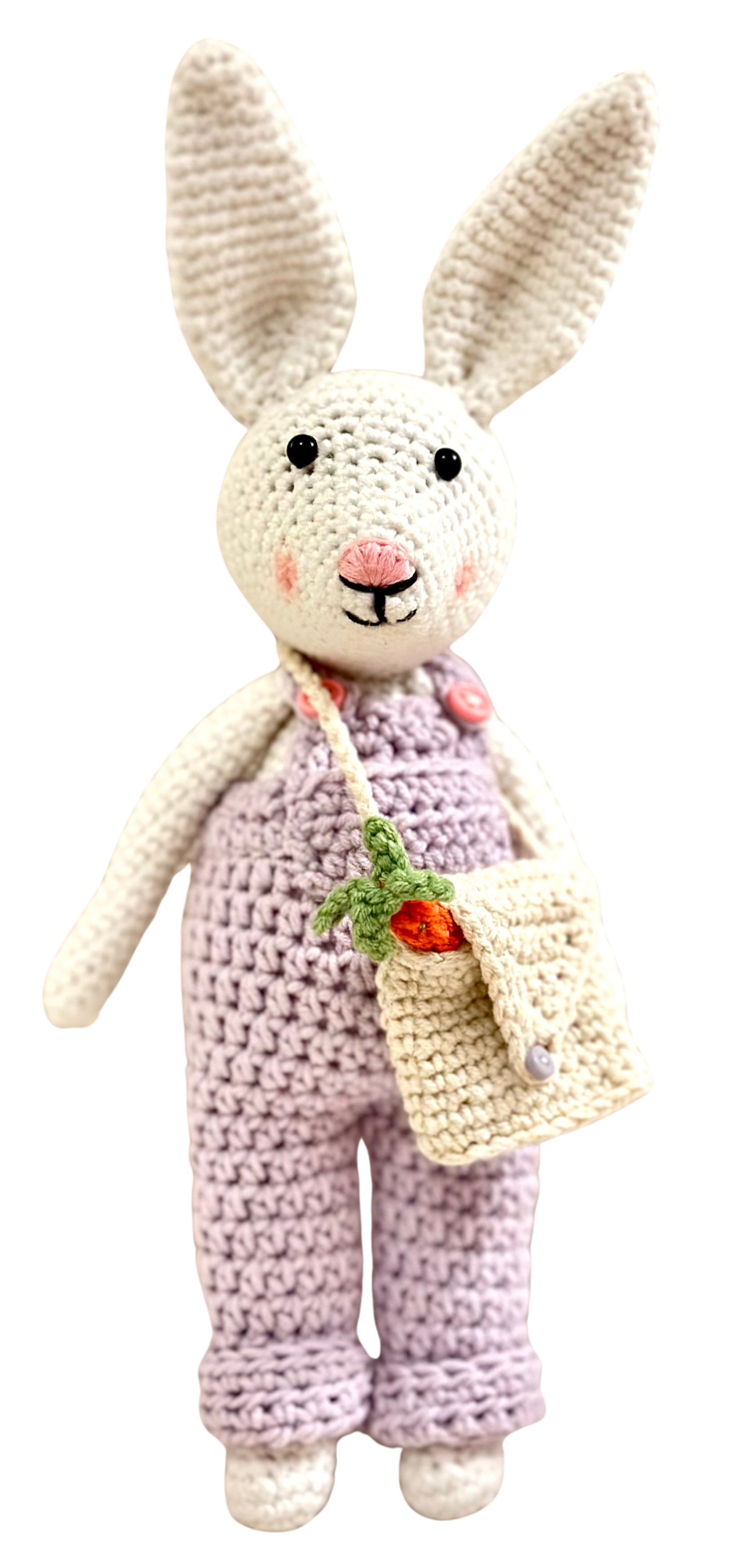 Reese the Rabbit, wearing purple overalls, created by Stitches by Moonlight. She is the healer and herbalist of Moonlit Hollow. A storybook world that follows the crochet characters who live there