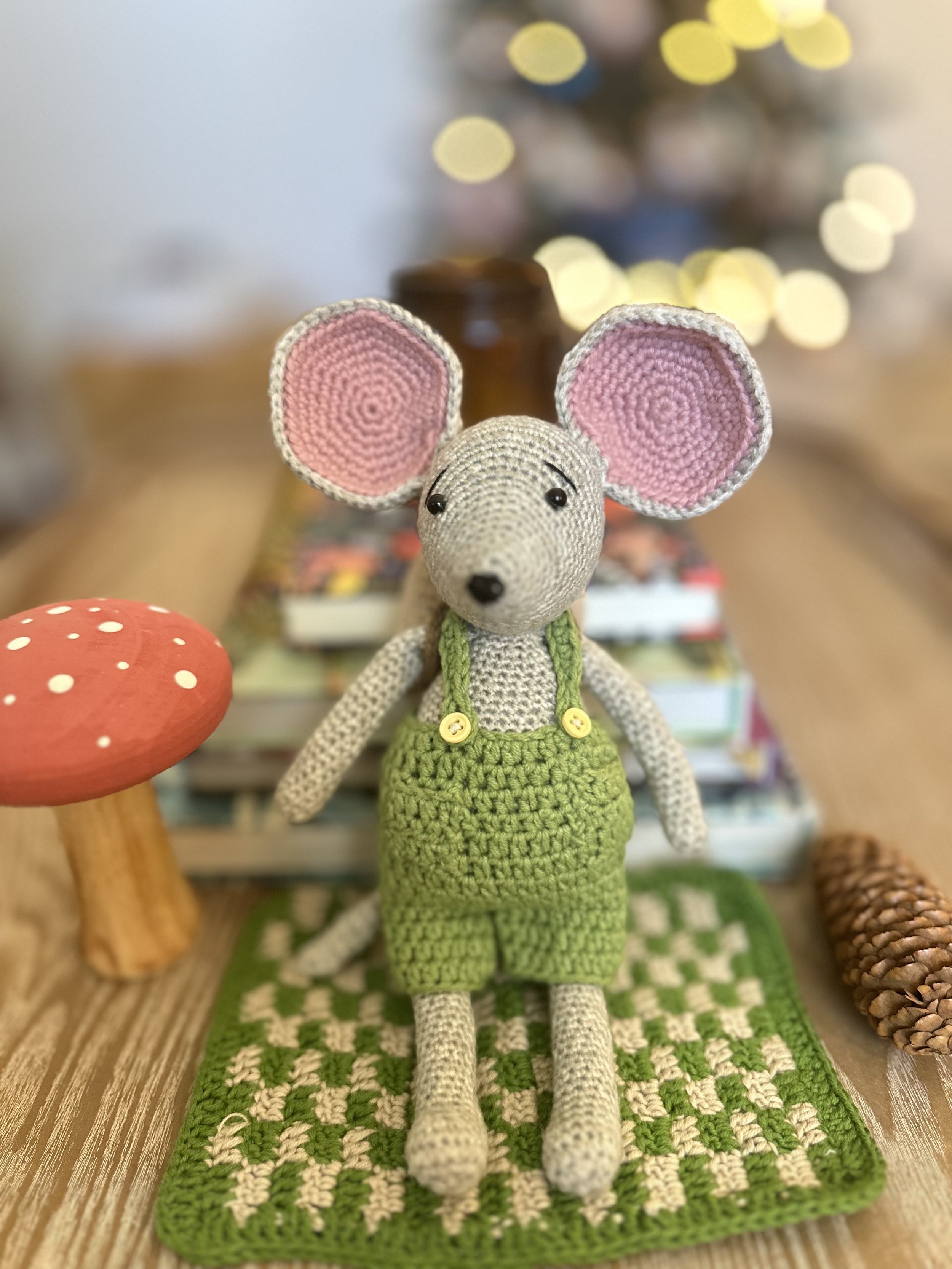 Max the Mouse, a handmade crochet amigurumi character from Stitches by Moonlight, wearing green overalls