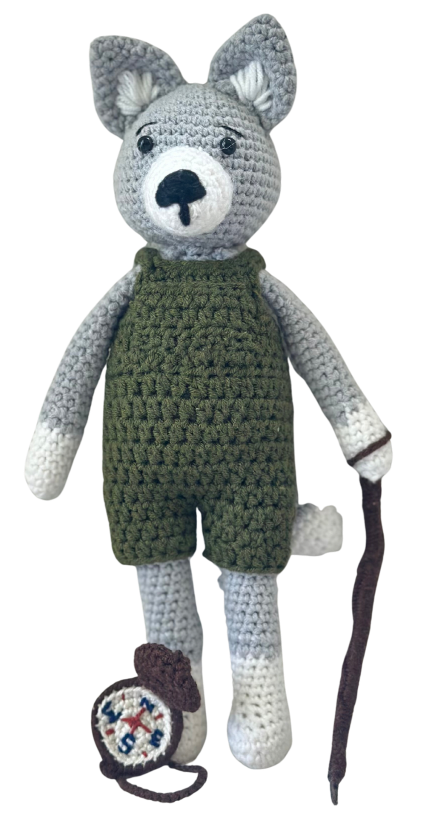 Wade the wolf, wearing green overalls, created by Stitches by Moonlight. He is guardian of Moonlit Hollow. A storybook world that follows the crochet characters who live there.