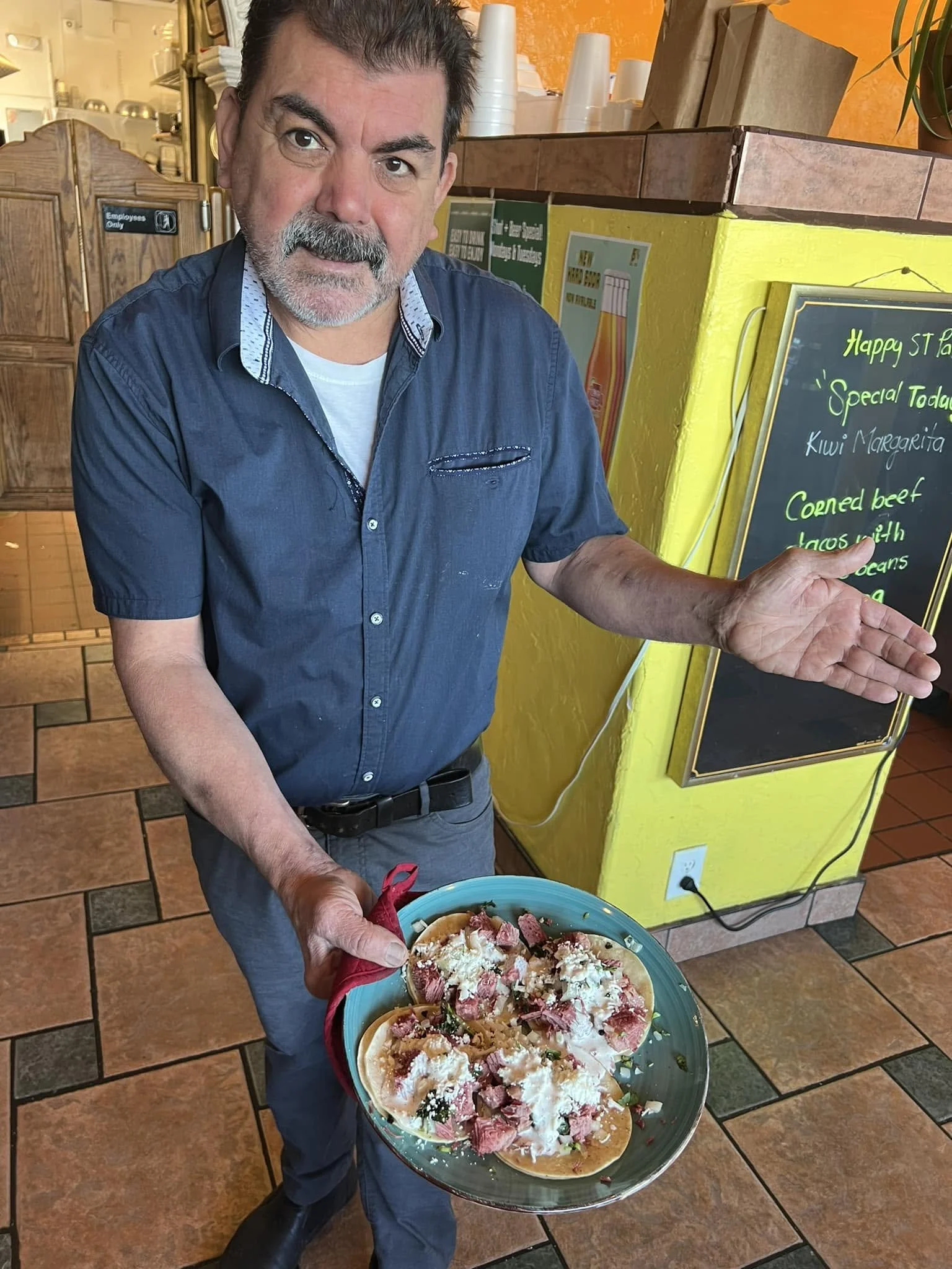 The owner of Dos Reales Stanwood, Pedro, serving up authentic street tacos.
