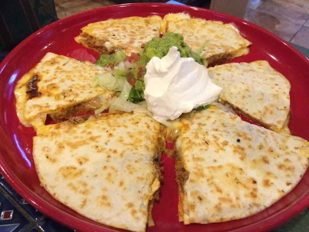 Our quesadilla is packed with meat & melted cheese and served with lots of guacamole & sour cream.