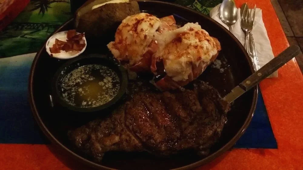 The Dos Reales Stanwood surf & turf featuring a one-pound char-grilled ribeye steak and large imported Australian lobster tails.