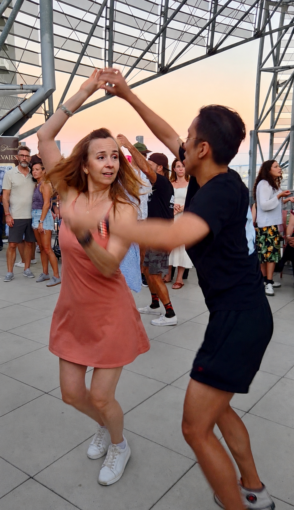 Couple swing dancing on the rooftop in San Diego