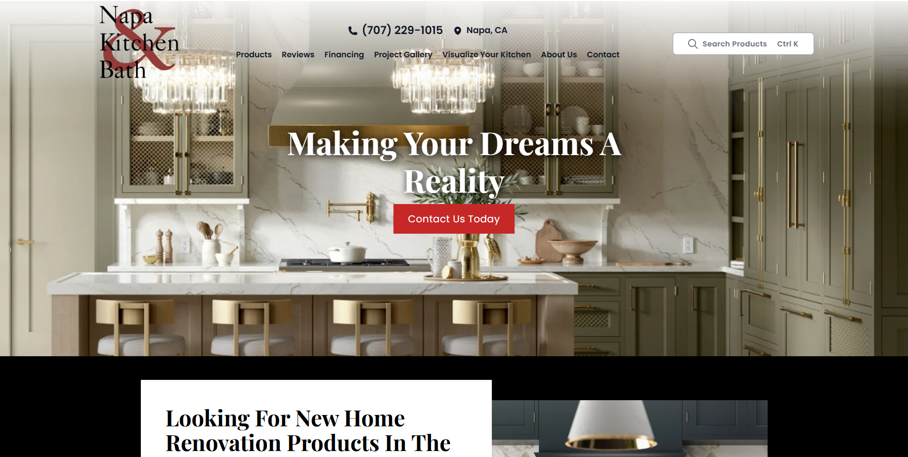 A modern kitchen with white marble countertops, gold accents, gray cabinetry, a central island with three bar stools, and a chandelier. The text overlay reads 'Making Your Dreams A Reality' with a red button labeled 'Contact Us Today'.