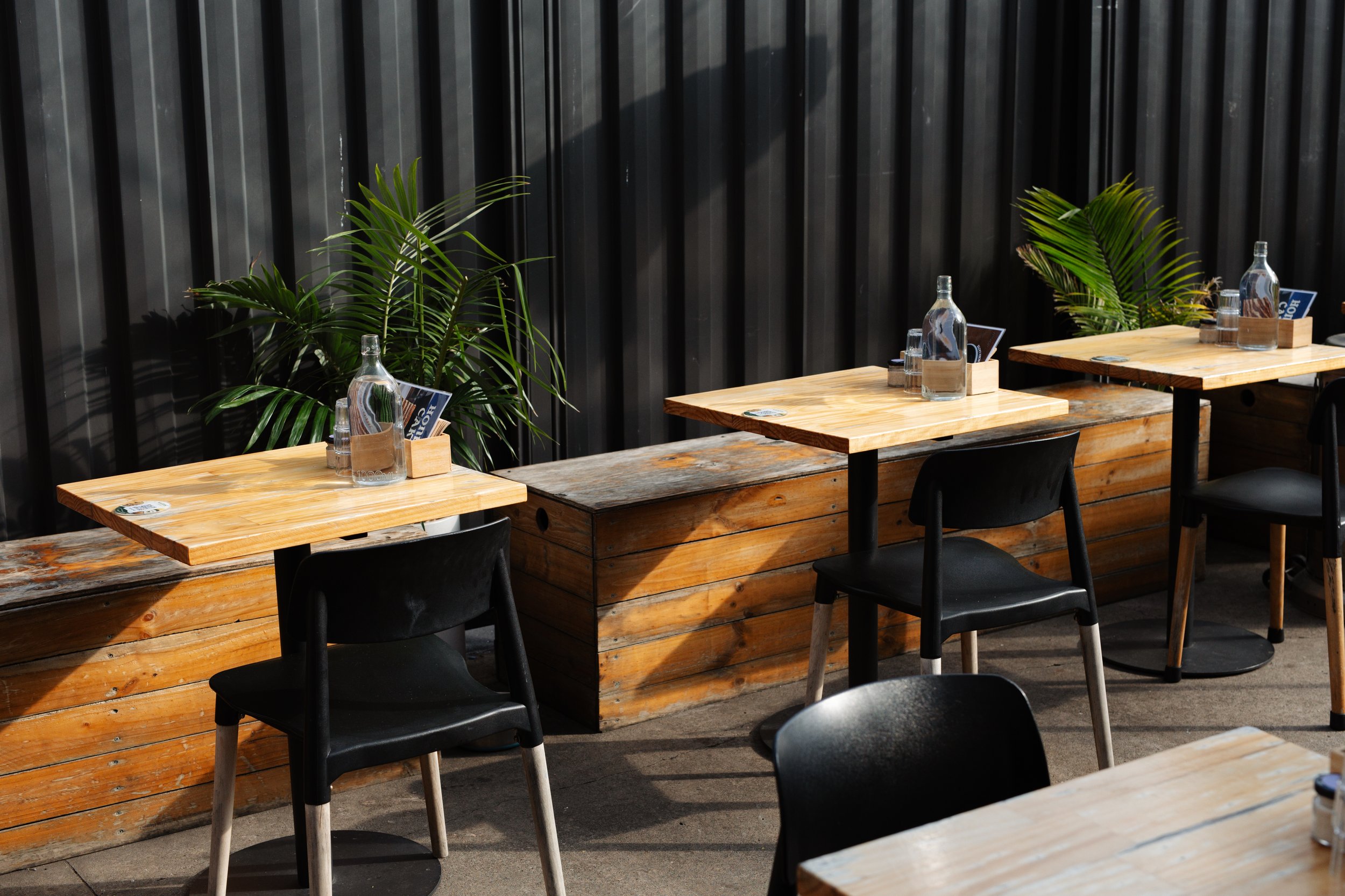Outdoor table setting at Migrant Coffee in West Footscray, perfect for bagels and coffee on a sunny day