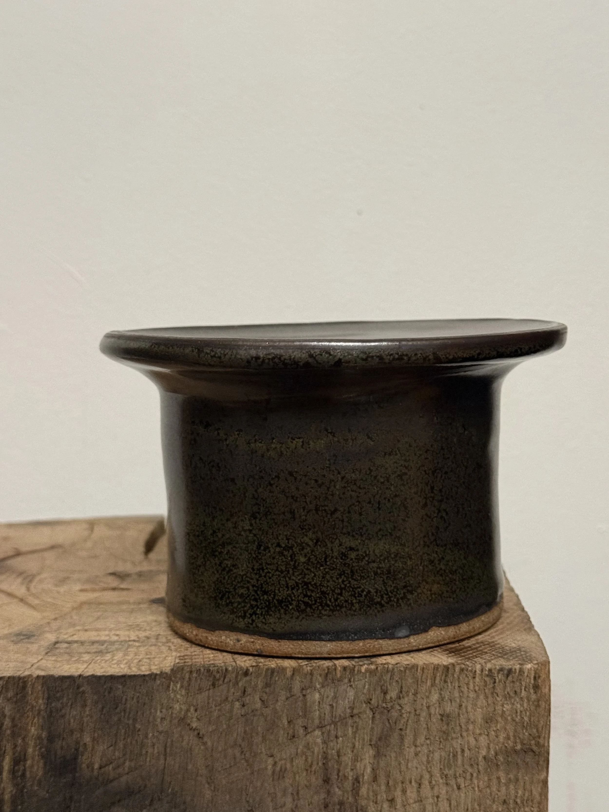 bronzed pedestal vessel