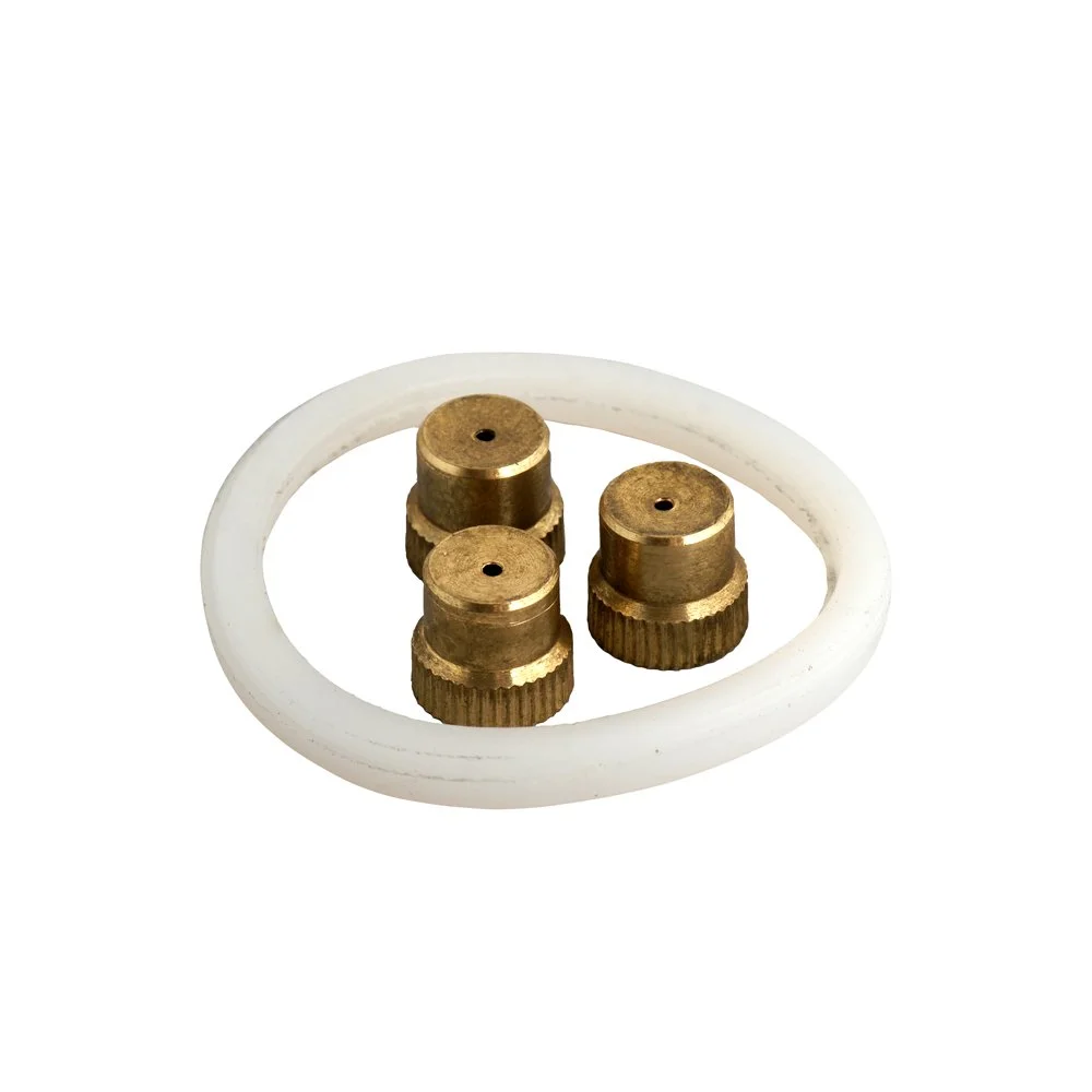 Three CoreGear brass replacement nozzle tips with one white O-ring.