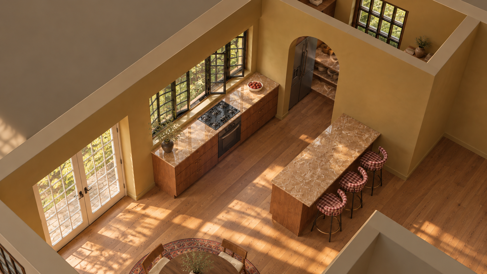 An aerial view of a kitchen with wooden cabinets, marble countertops, a gas stove, and a stainless steel refrigerator. Large windows let in natural light. There is a marble-topped island with three checkered bar stools.