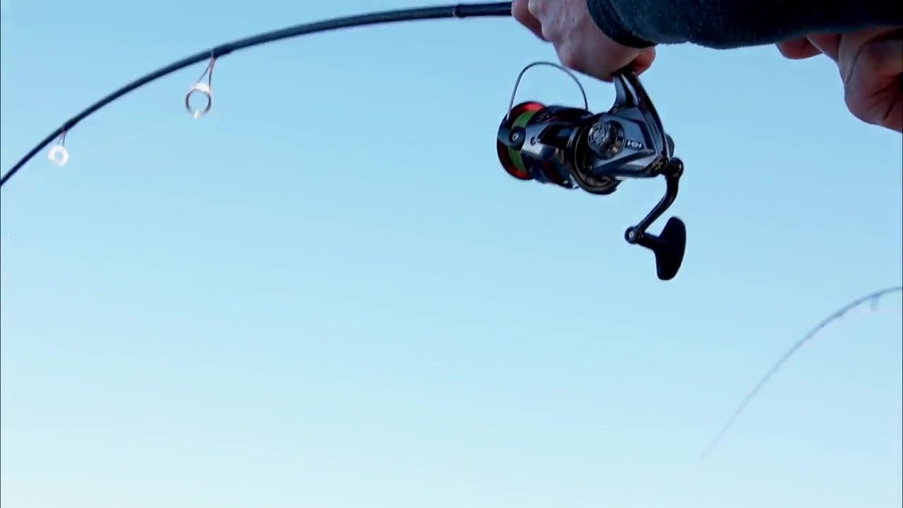 Low-angle action frame of the Stradic CI4+ and rod against blue sky, taken from my original film.