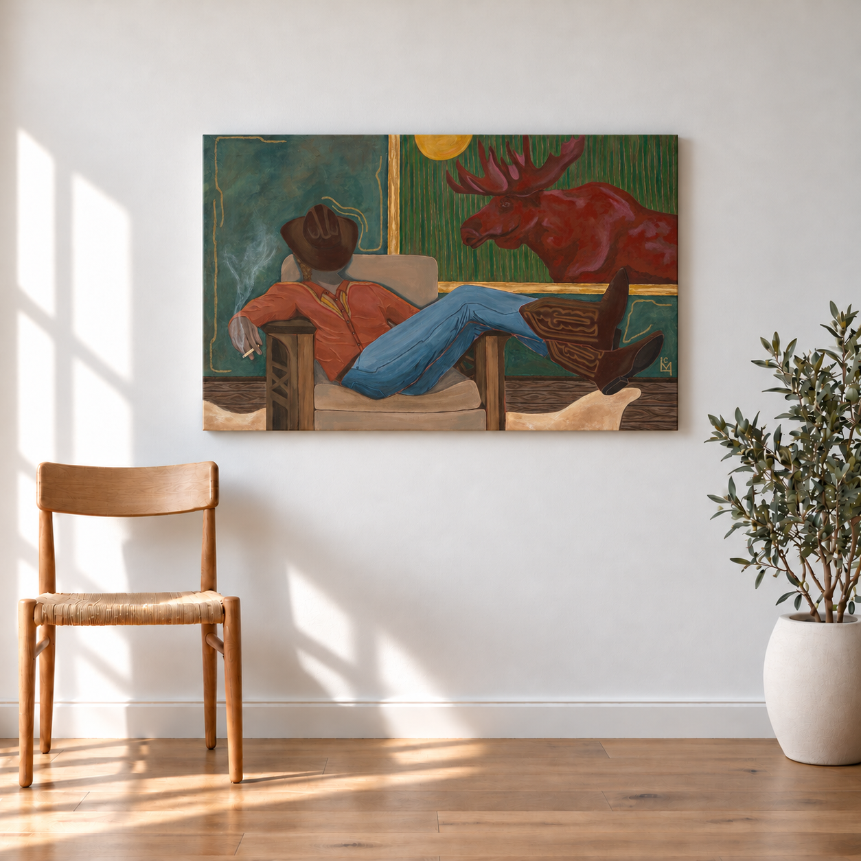 Earth-toned moose canvas in a sunlit room.png