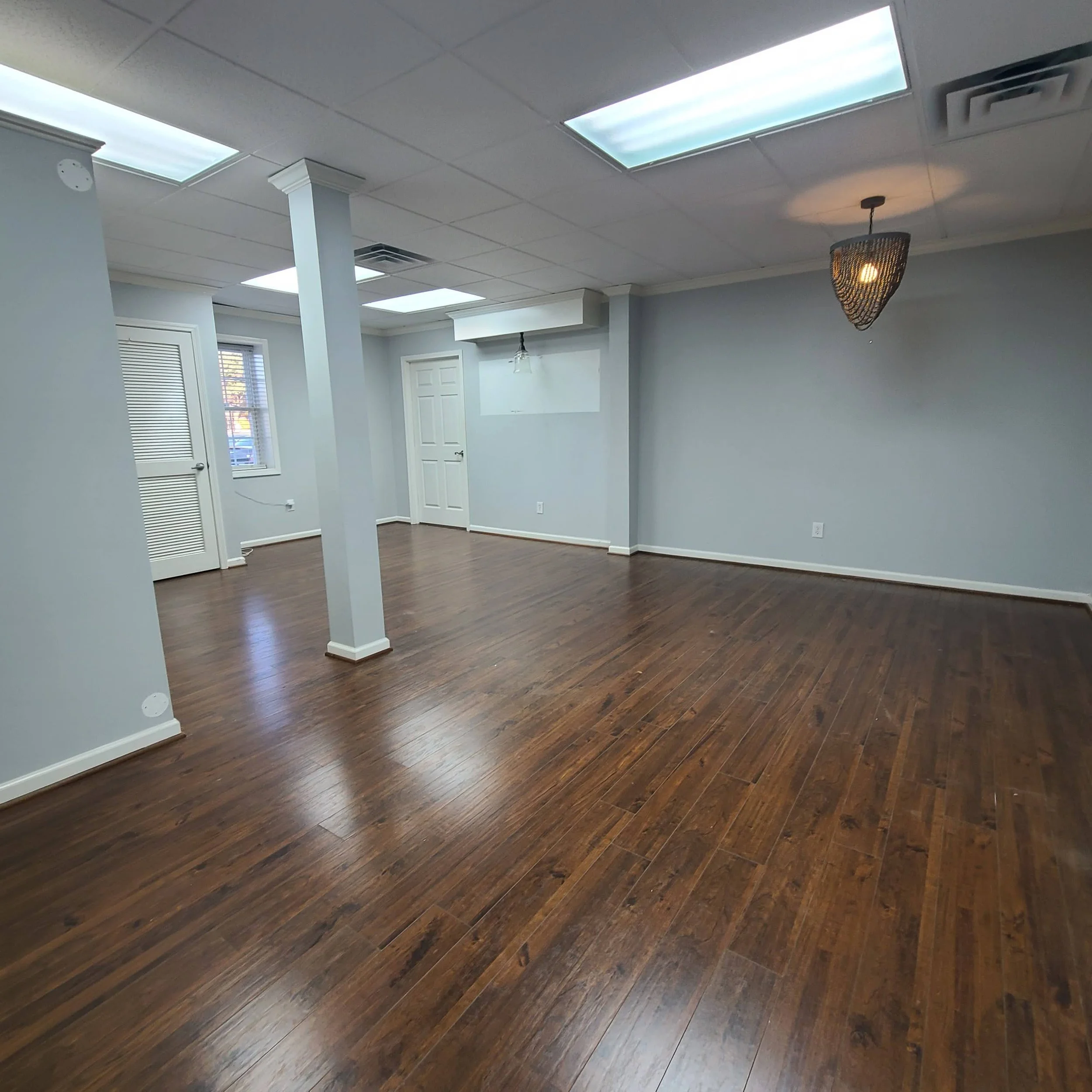 Finished room with hardwood floors and skylights after a construction debris removal job in Memphis, TN.