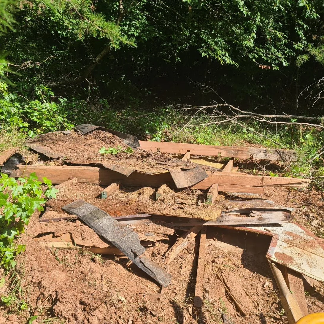 Damaged wooden structure being cleared during a demolition and debris removal job in Memphis, TN.